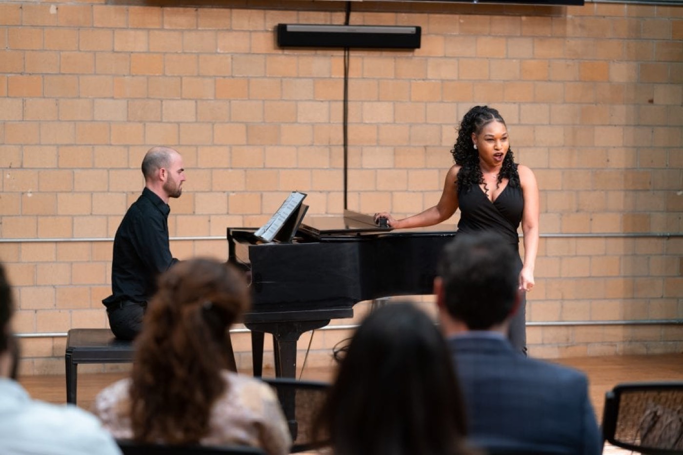 Stephanie performing in recital with a pianist